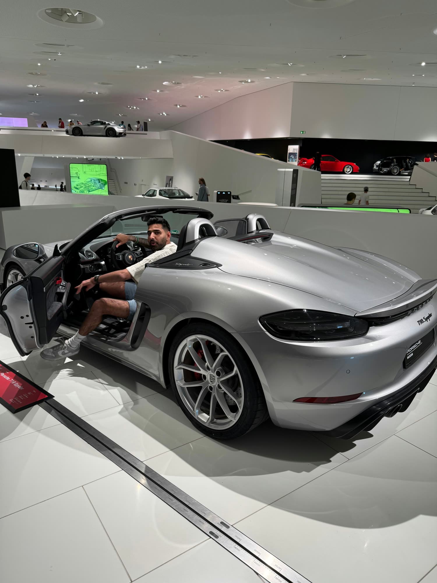 Me leaning out of the open door of the silver Spyder